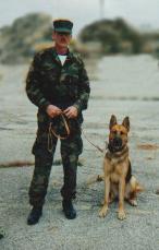 Trainer John A Sampson I with scout dog Rex
